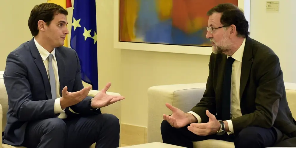 Spanish Prime Minister Mariano Rajoy (R) speaks with Ciudadanos (Citizens) political party's leader and candidate for the December 20 Spanish general election, Albert Rivera during a meeting at the Moncloa Palace in Madrid on October 30, 2015. Rajoy met with the leader of the main opposition Socialists, Pedro Sanchez, earlier this week and today meets with the leader of new centre-right party Ciudadanos, Albert Rivera, and later in the afternoon with leader of new far-left party Podemos Pablo Iglesias in a bid to craft a unified response to a Catalan separatist drive, his office said . AFP PHOTO / JAVIER SORIANO
