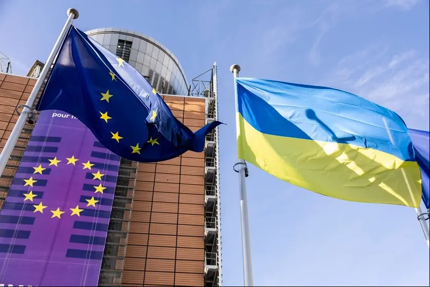 European and Ukrainian flags raised in front of the Berlaymont building to commemorate the third year of the Russian invasion of Ukraine